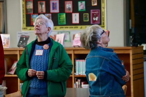 Ev Tate and Susan Abbott take a look around the library and see how much its changed since their time at WHS. Abbott shared a memory of the time she was working in the library when a plane on fire flew by the windows and landed behind the football field.