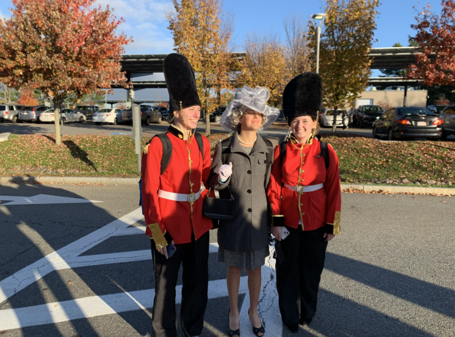 From left to right, seniors Lila Powers, Lucy Grasso and Tess Alongi pose for a photo in their costumes. Grasso is the Queen of England, while Alongi and Powers were royal guards.

wspn · Tess Alongi On Royal Guard Costume