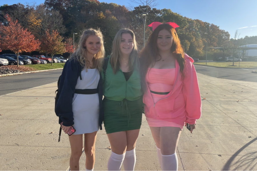 From left to right, seniors Jillian Carr, Nicole Henderson and Bryn Curtin wear their Powerpuff Girls costume. The group chose their costume because it made for a fun trio that included a character with red hair.