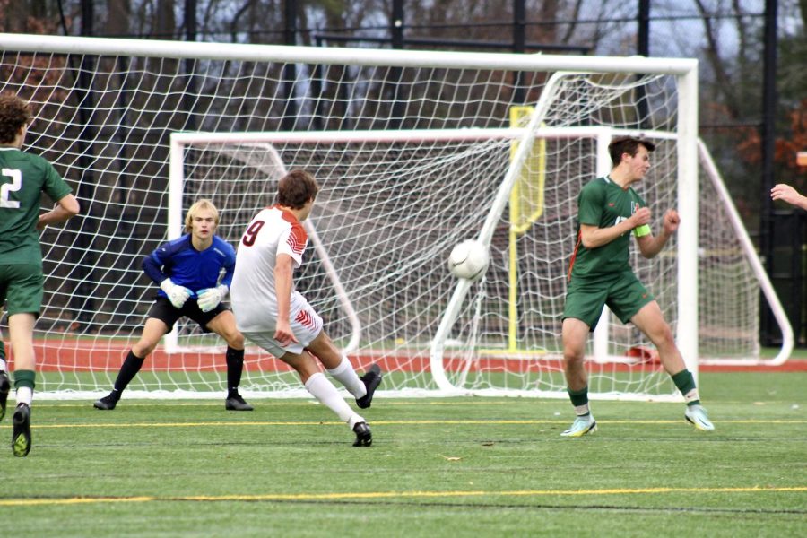 Senior Fred Czauderna takes a shot at the Hopkinton goalie. Although this shot didnt make it in, Czauderna scored one of two goals for the team.