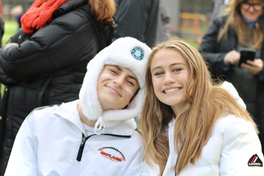 Junior Giovanni Sebastianelli and senior Delia Caulfield show off their spirit by following the white-out psych.