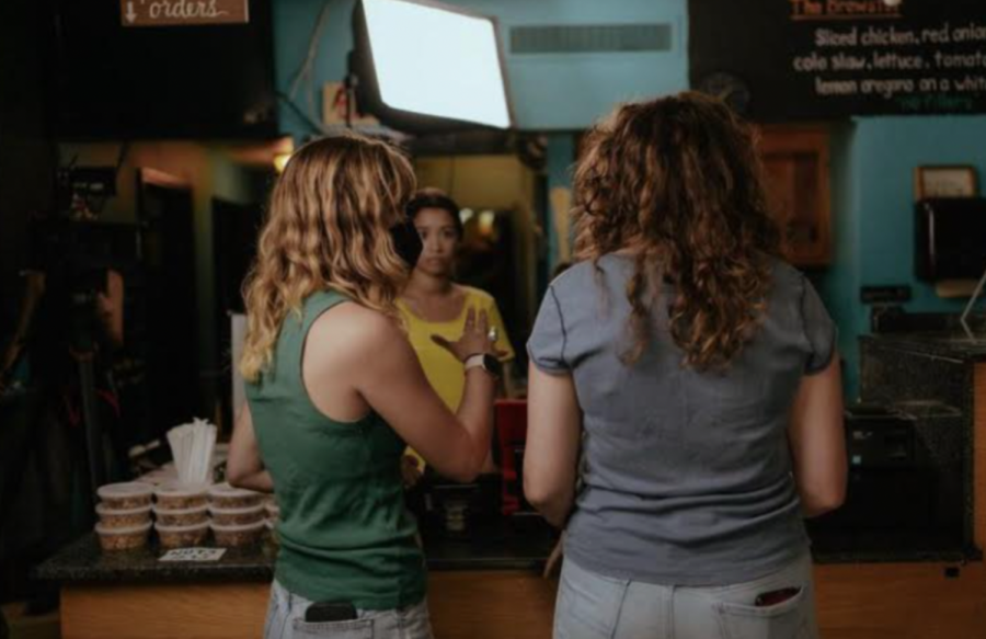  Senior Molly Morneweck (right) stands on the set of Growing Pains, the movie in which she plays the part of a teenage girl named Zoe Christopoulos.