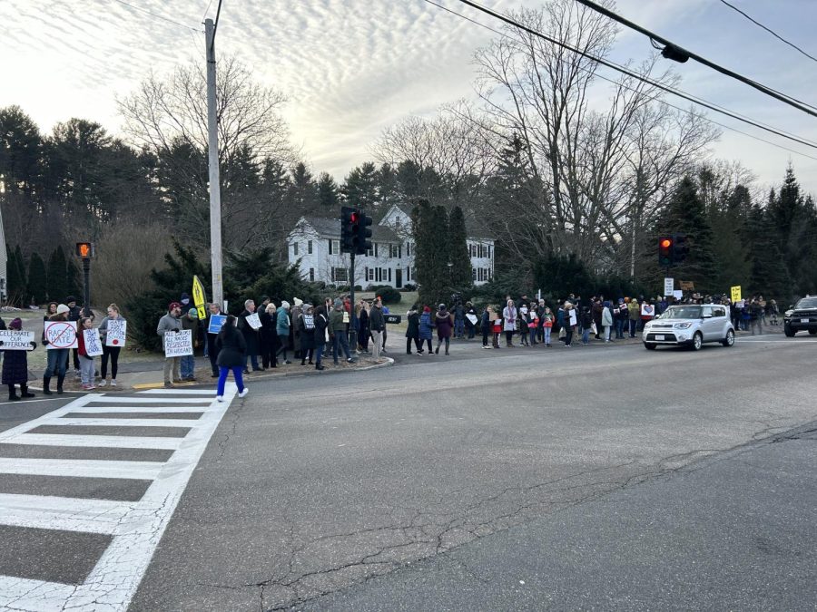 Wayland+community+members+gather+along+Old+Connecticut+Path+in+front+of+the+entrance+to+Wayland+High+School.+Demonstrators+voiced+their+support+of+Superintendent+Omar+Easy+following+the+racist+graffiti+targeted+towards+him.