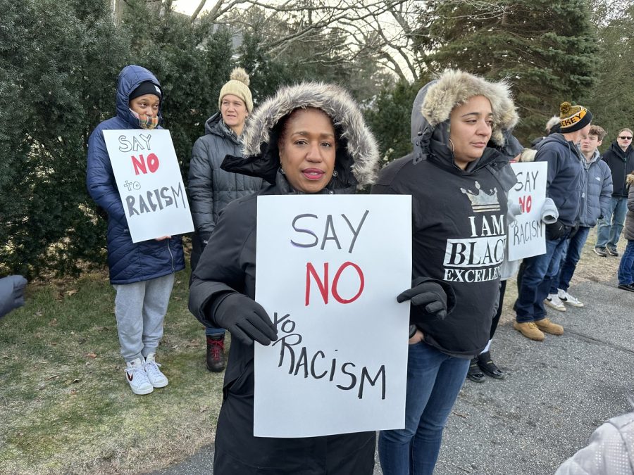 METCO parents hold signs with the uniform message say no to racism written on them. The racist incident regarding Dr. Omar Easy sparked conversations within the METCO community,  and parents organized a meeting on the night of Dec. 21 to discuss the incident. [METCO] parents had a meeting yesterday, and 40 parents attended and talked about what had happened, Dorchester resident and METCO parent Toni Lopes said. Thats why so many METCO parents came out today to protest.