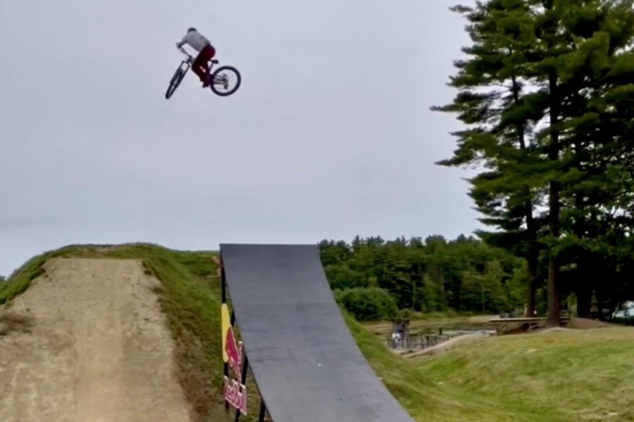 Sophomore Thomas Ali does a jump at Highland Mountain Bike Park in Northfield, New Hampshire. I love mountain biking because there’s a great community surrounding it and uplifting everyone,” Ali said. “The adrenaline is just awesome. I love flying through the air.”