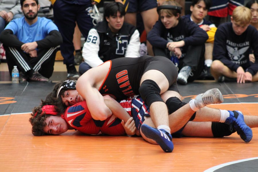 Senior captain Seth Rosen puts a Bridgewater-Raynham wrestler into an arm bar at the Wayland holiday wrestling tournament. Due to COVID-19, the tournament hasn’t taken place since 2019. Five Wayland wrestlers successfully placed at the meet, which had 19 different towns competing.