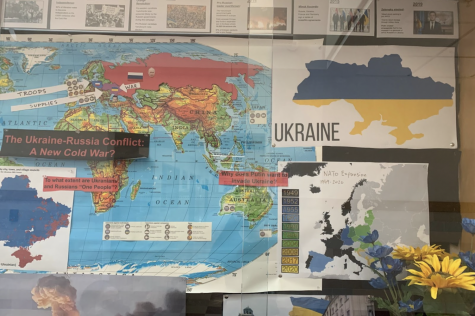 Made by the current events class last school year, a display on the Russia-Ukraine war hangs in the History Wing. The display has since been taken down, as over a year has passed since the war began. “This war shouldnt have started,” junior Misha Eberle said. “Nobody should have to die over these geopolitical forces that are just playing a game of chess. These [people] are just pawns in the game. So every death in this war is a tragedy.”