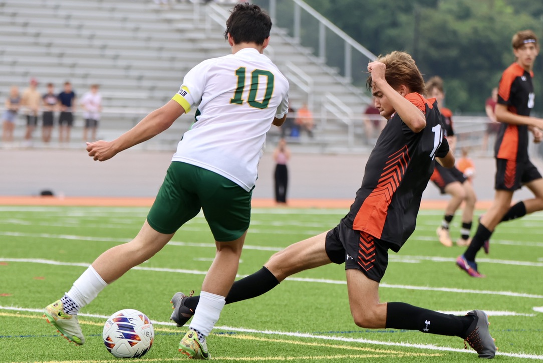 Senior Henrique Abecasis slide tackles his opponent. Abecasis is an exchange student from Portugal.