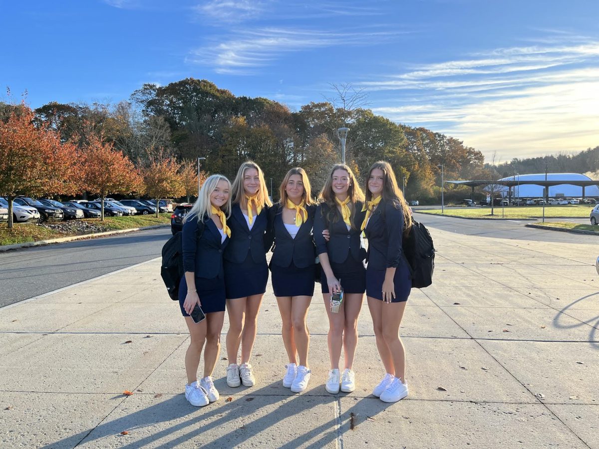 Seniors (left to right) Talia Macchi, Maggie Melander, Lily Mele, Abby Raftery and Lilly ODriscoll dress up as the The Barden Bellas from the movie Pitch Perfect.  We picked this costume because Pitch Perfect is our favorite movie and soundtrack, Melander said. 
