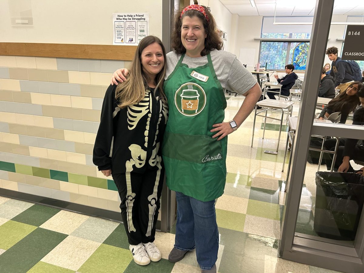 WHS math teachers Jacy Anzalone and Deborah Buchman dress up for Halloween. Anzalone is a skeleton and Buchman is a barista.