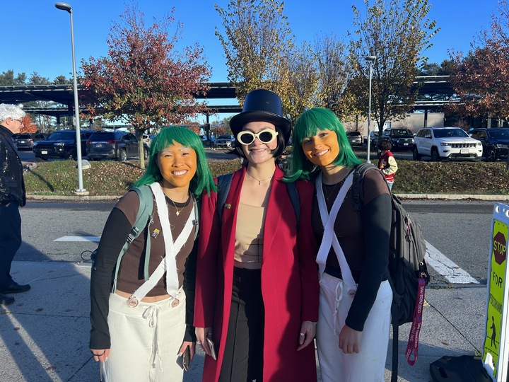 Seniors Michelle Yee, Sierra Dale and Anna Munford dress up as oompa loompas and Willy Wonka from the musical Charlie and the Chocolate Factory. Im more specifically thirst trap Willy Wonka from TikTok, which is why I have abs drawn on, Dale said.