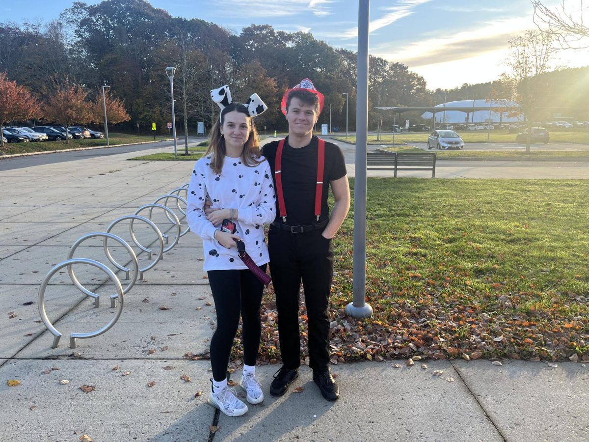Seniors Natalie Glazer and Thomas White dress up as a firefighter and dalmation.