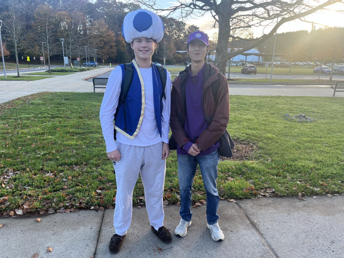 Seniors Thomas Kiernan and Brendan Shen pose side-by-side as Mario characters. Kiernan wears a Toad costume, while Shen wears a Waluigi costume.