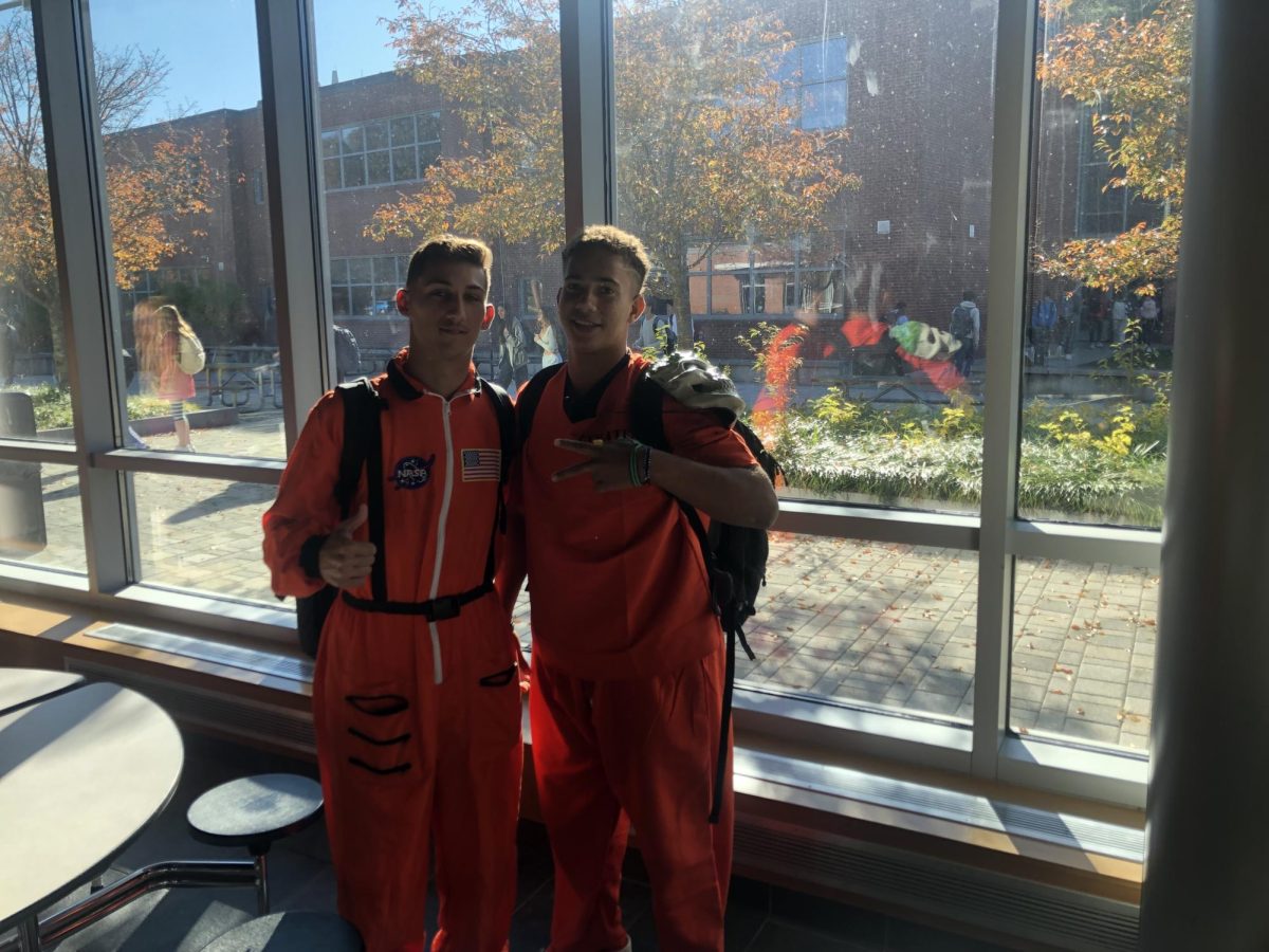 Seniors Dion Marcos (right) and Xande Santos (left). Marcos is dressed up as a prison inmate and Santos is a astronaut.