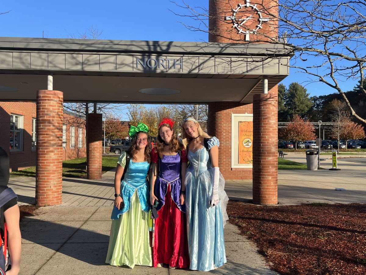 Seniors Maddie Genis, Sophie Roman and Ava Balukonis dress up as Cinderella and her evil step sisters for Halloween.
