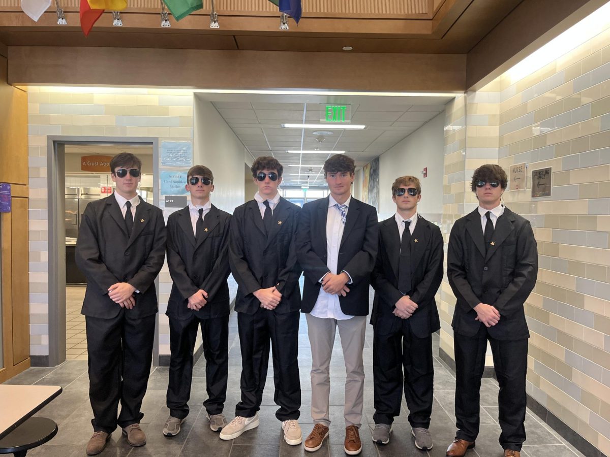 (From left to right) Seniors Jack Ali, Jake Newton, Joey Burke, Zach Rainville, Andrew Medeiros and  Charlie Lieb dress up as the secret service.
