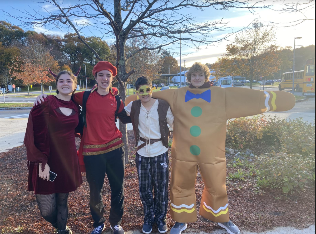 Senior Bethany Foreman (the dragon) Wilson Harding (Lord Farquaad) Max Markarian (Shrek) and Ben Mohnkern (The ginger bread man) all decide to be famous characters from the movie Shrek. Their inspiration was that they wanted to find a funny group costume they could all do