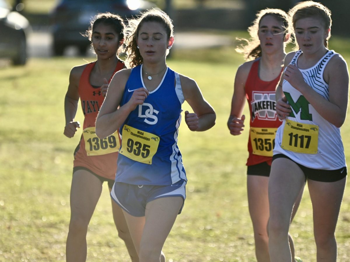 Captain junior Arya Samaratunga (far left) runs with a group. Samaratatunga was the only girl to qualify for the meet from Wayland. In order to qualify for the MIAA Meet of Champions, a team must place in the top seven in the MIAA divisional race. If a team does not qualify, it can send individual athletes who come in the top ten outside of teams that qualify.