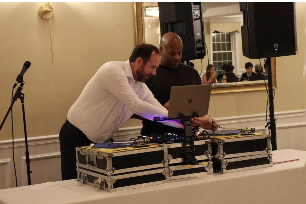 Wellness Teacher and Science Department Head John Berry DJs for the  Class of 2026s semi-formal dance. 
“What I love the most about DJing is when the crowd is full of joy and everyones having fun, dancing and there are no bad attitudes,” Berry said. “Its just pure joy on the dance floor. I love creating and facilitating those moments.”