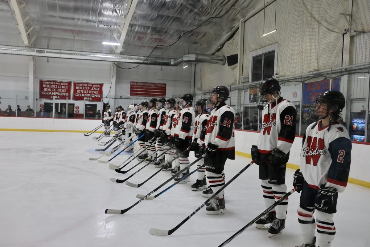The Watertown/Wayland Raiders line up before the starting players are announced for the 2023 Post Road Cup.