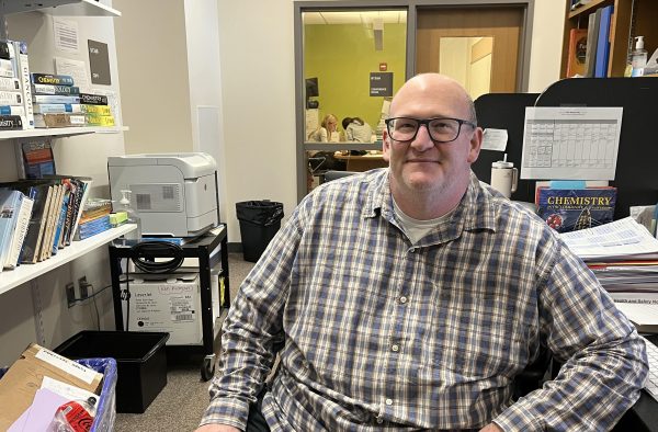 Wayland High Schools new Science Department Head Bill Bobrowsky sits at his desk in the science office. This year, Bobrowsky teaches both sophomore environmental chemistry and senior forensic science on top of being the department head. 