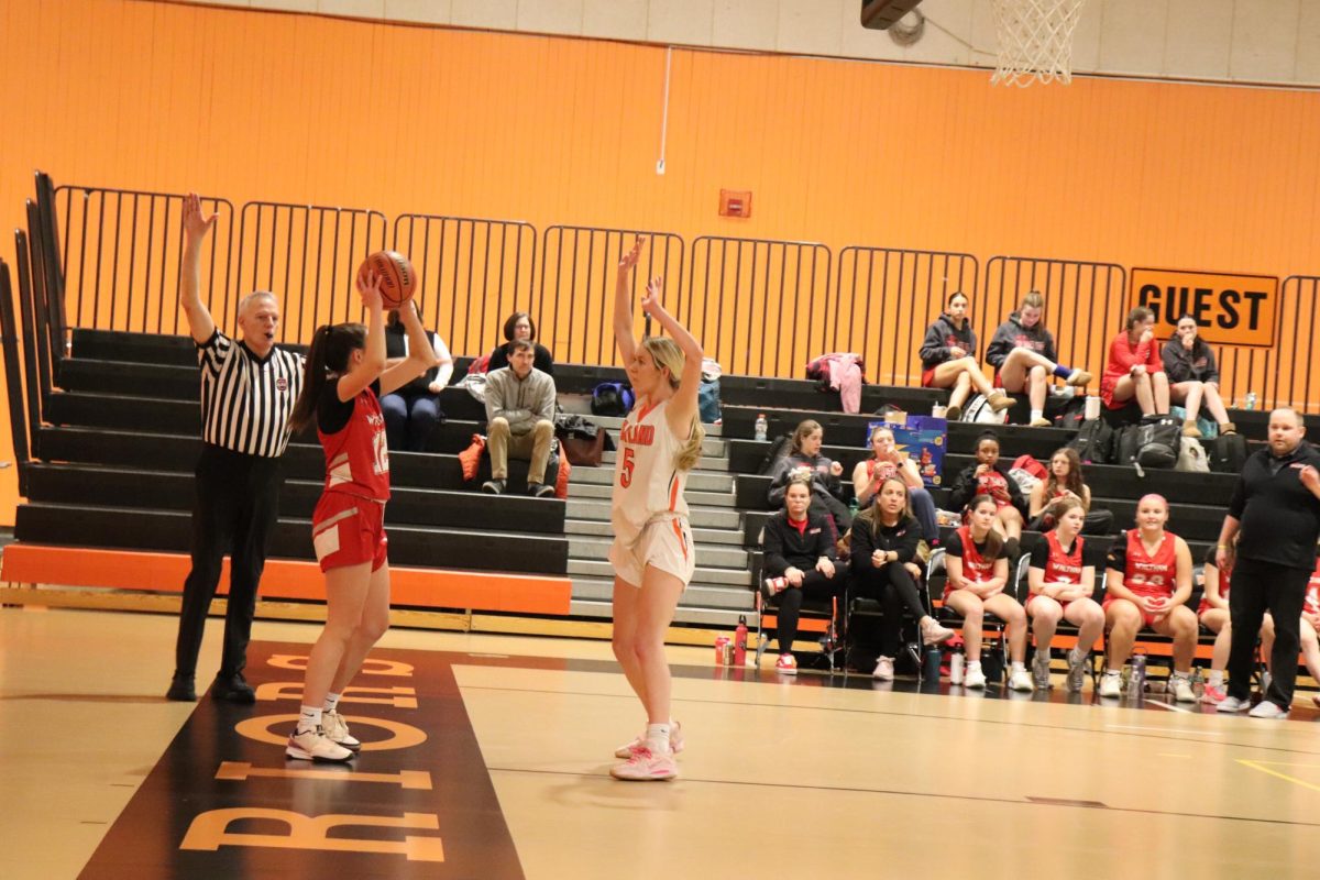 Sophomore Sarah Powers puts her hands up in an attempt to block her opponents inbound pass.