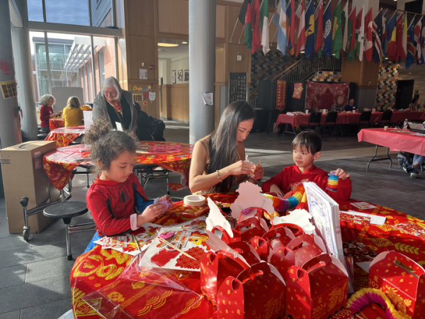 Wayland residents build a rainbow dragon craft at the Lunar New Year celebration to welcome the year of the dragon. “Chinese culture is very important and the [WHS Chinese National Honor Society] wanted to share that culture with everyone,” junior and performer Sadie Batista said.