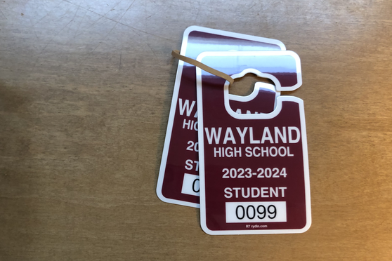 A Wayland High School parking pass is pictured above. Parking passes are required for all students who park in the high school parking lot. Passes can be picked up at the front office, after the student fills out the proper registration and pays the correct amount of money.