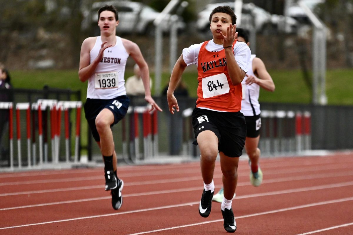Sophomore Ethan Alves wins his heat of the 100 meter dash. Due to rain, the first dual meet against Bedford was postponed to a later date, so the meet against Weston was the first meet for the team.