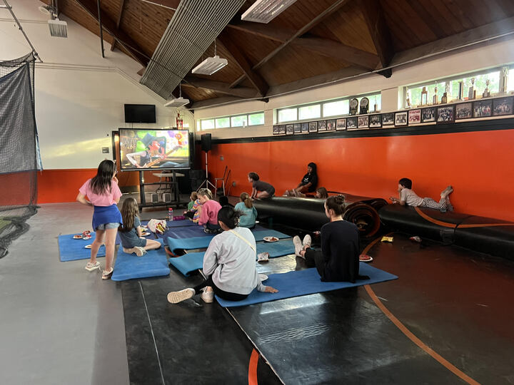 On Friday, May 17, the Sophomore class Eboard hosted a Kids Night for children K-6 in the Wayland High School field house. Kids gathered around a projector in the wrestling room with snacks and yoga mats to enjoy a movie.