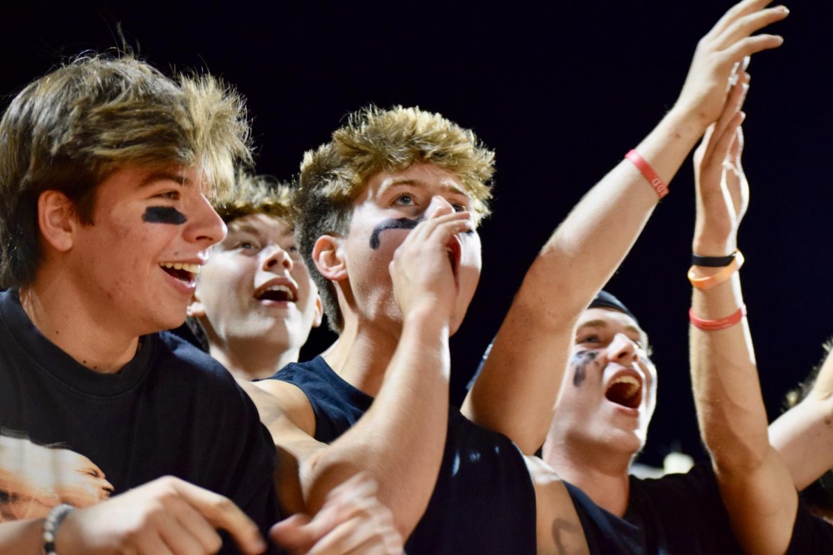 During the third quarter, senior Cole Duffy cheers on Wayland after making a good play.