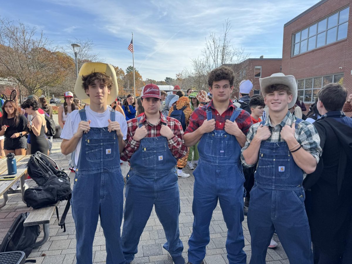 Seniors Bowen Morrison, Desmond Ward, Max Dressens and Luke DiPietro-Froio pose for a photo in the courtyard. The group dressed up as farmers.