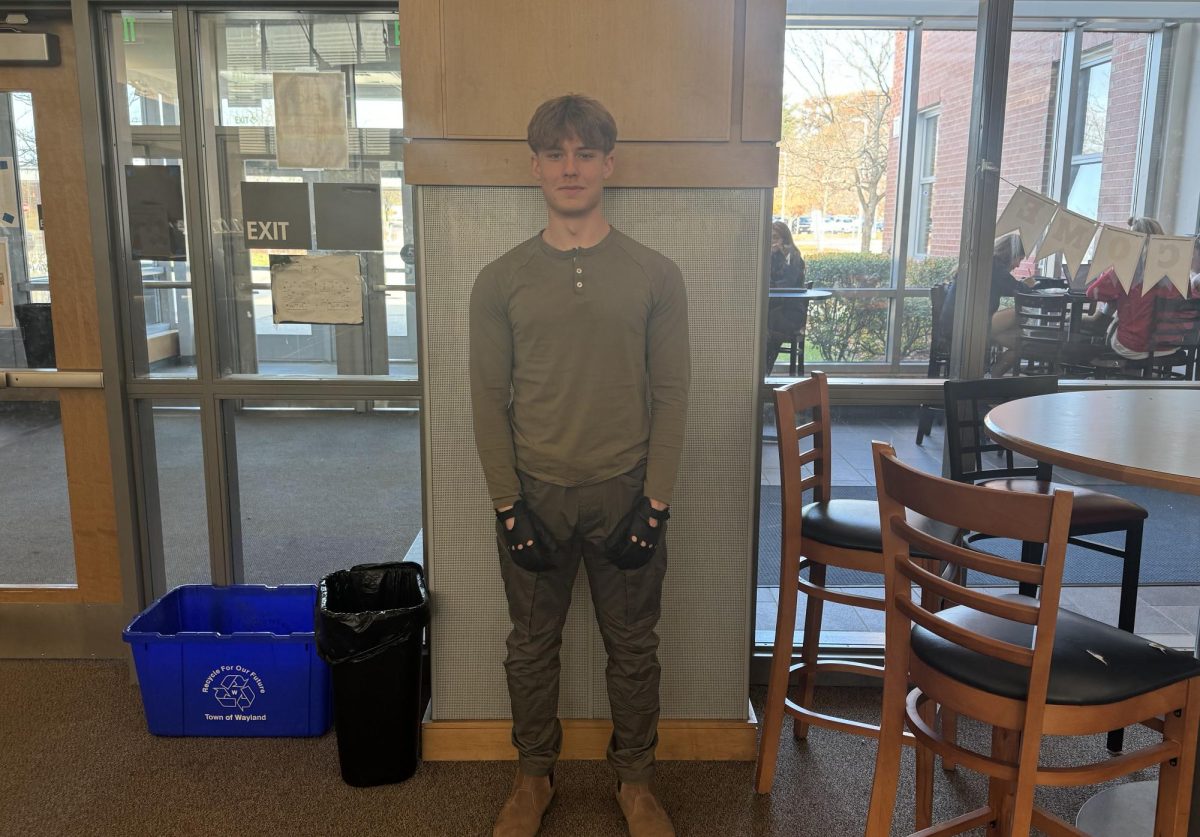 Senior Cooper Szeremeta poses for a picture in his Dexter Morgan costume from the show "Dexter."