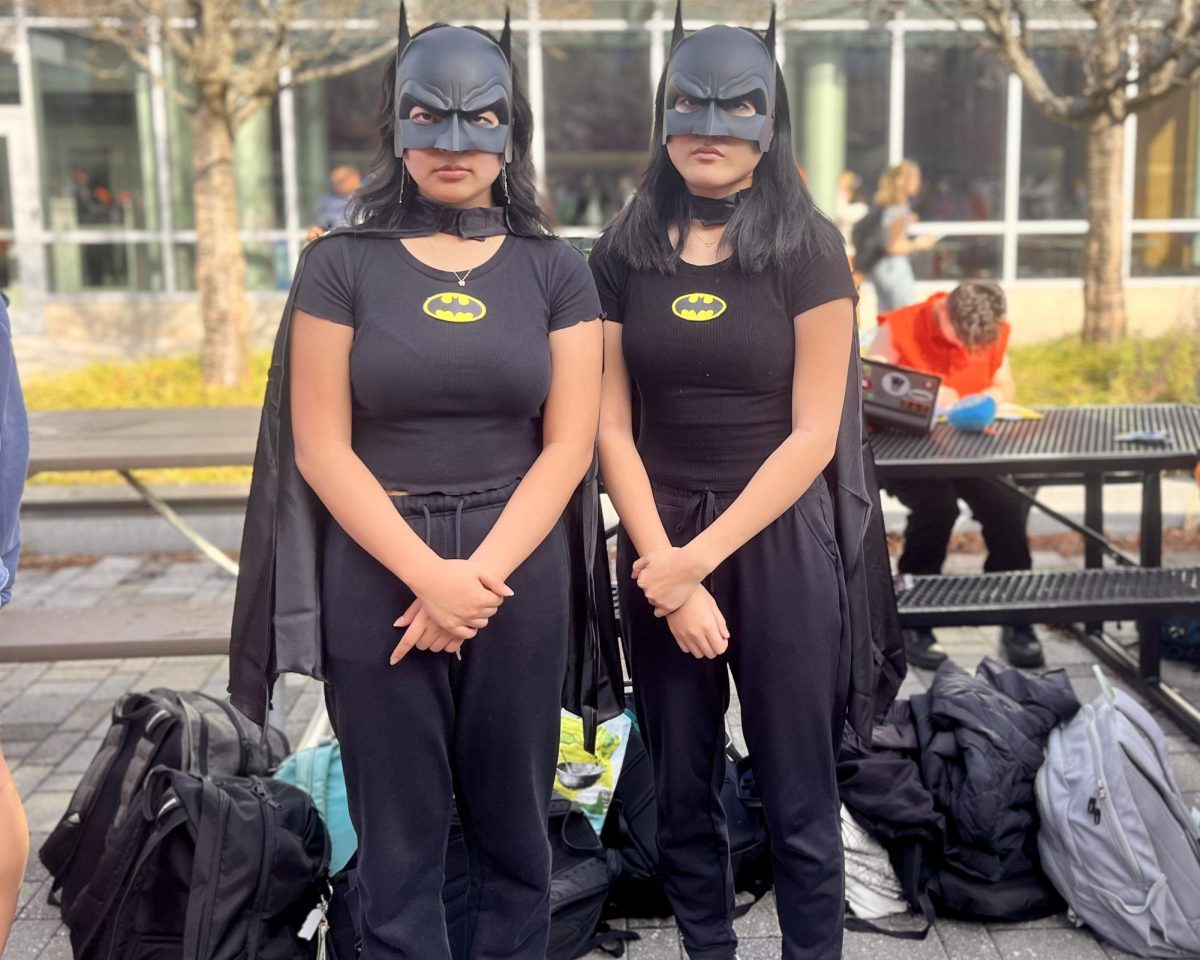 Seniors Eunjee Kang (left) and Sydney Chuang (right) dress up as Batman.  "We stay up really late doing our homework a lot, especially because of senior year, so we call it our Batman session,"  Chuang said.