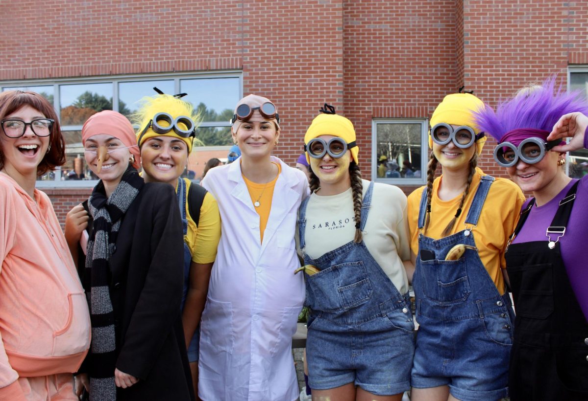 From left to right: seniors Sarah Rice, Andie Newton, Abby Rice, Jules Boyajain, Zoe Mittelsteadt, Ella Duffy and Ella Mosoffian join together to take a photo.