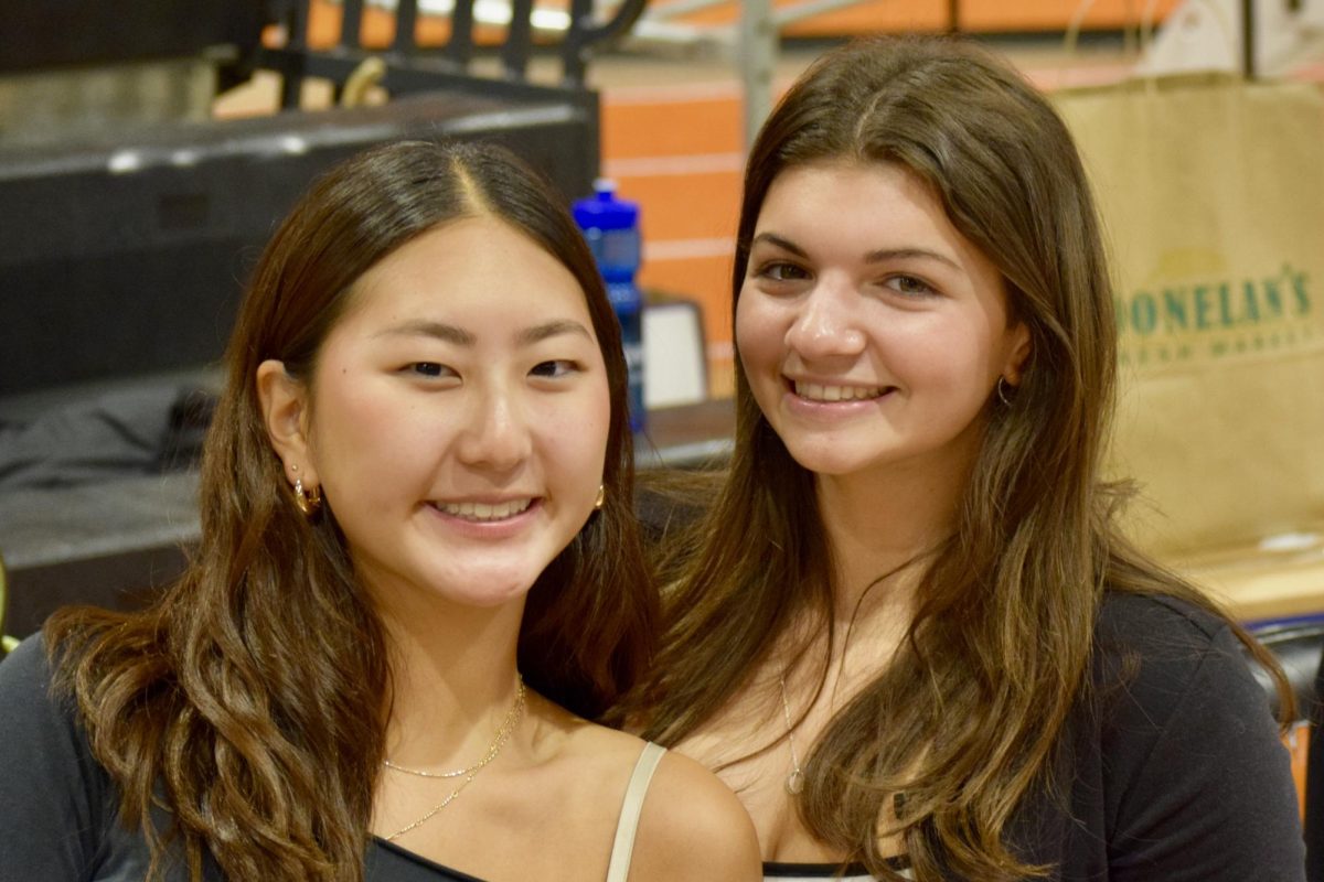 Seniors Mischa Lee and Elyssa Grillo pose for a photo. Lee and Grillo are both members of the National Honors Society which partnered with the Connect Program and SADD for this event.