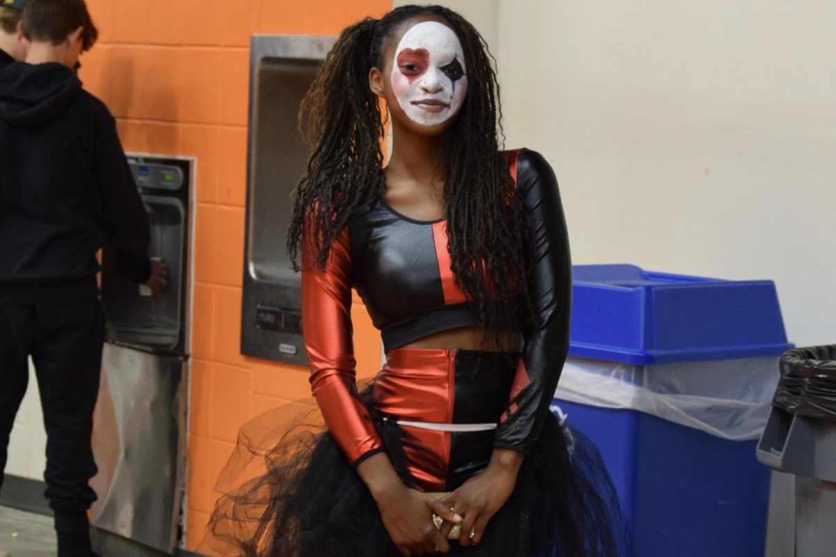 Senior Nehlan Bonds smiles before she has to go back into the haunted house. The Connect program held the haunted house walk through in the girls and boys locker rooms located in the WHS field house.