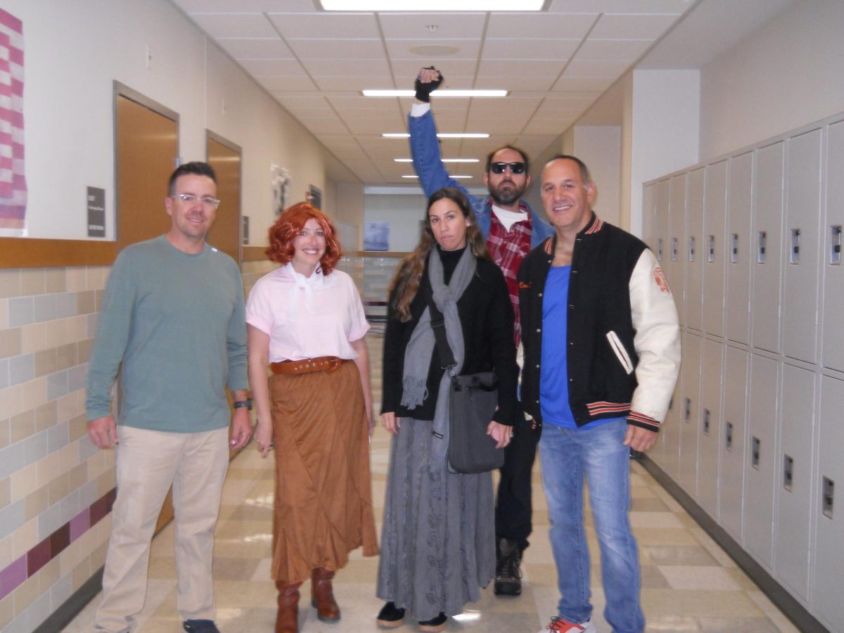 Flashing back to 1985, the wellness department teachers dress up as the five main characters from the movie "The Breakfast Club."