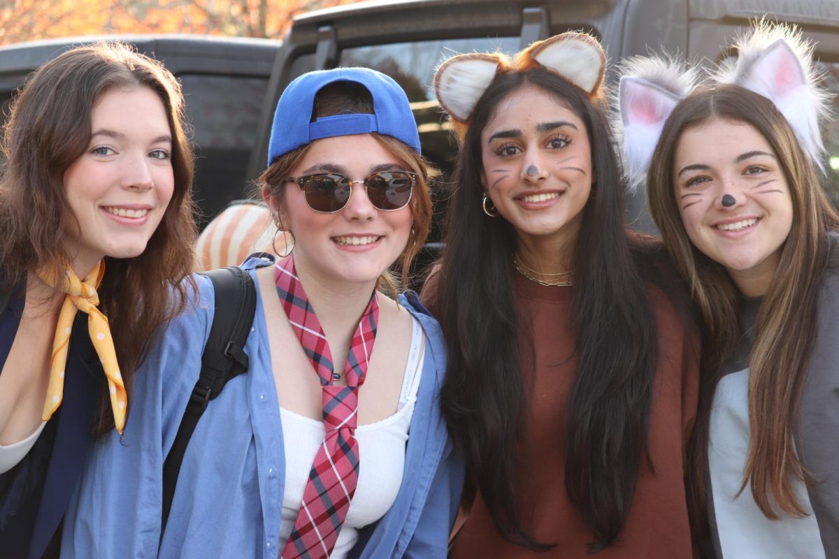 Left to right: seniors Lily Thompson, Mackenzie Regan, Revathi Srinivasan and Olivia Todd smile for a photo.