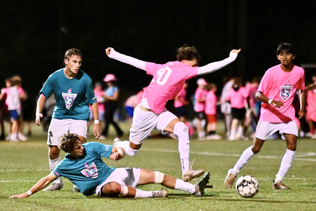 Senior Caio Bonato slide tackles a Westford Academy player. On the other turf field, Concord-Carlisle (CC) played Lincoln-Sudbury (LS). LS beat CC, 3-0.