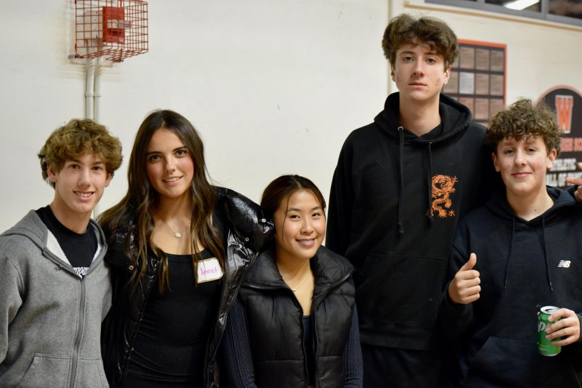 From left to right, sophomores Jamie Goodman, Anna Fiori, Zuri Yee, Jake Pearlman and Dante DeFrancesco pose for a photo. The group volunteered to help with the event by setting up and cleaning, as well as helping out with activities.