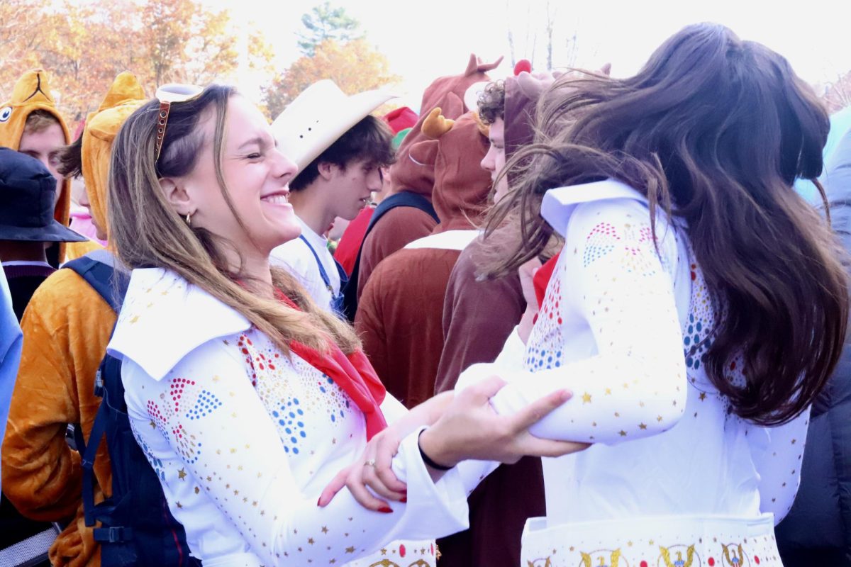 Enjoying their advisory, seniors Melina Barris (left) and Elyssa Grillo (right) dance around to embody their Elvis Presley costume.