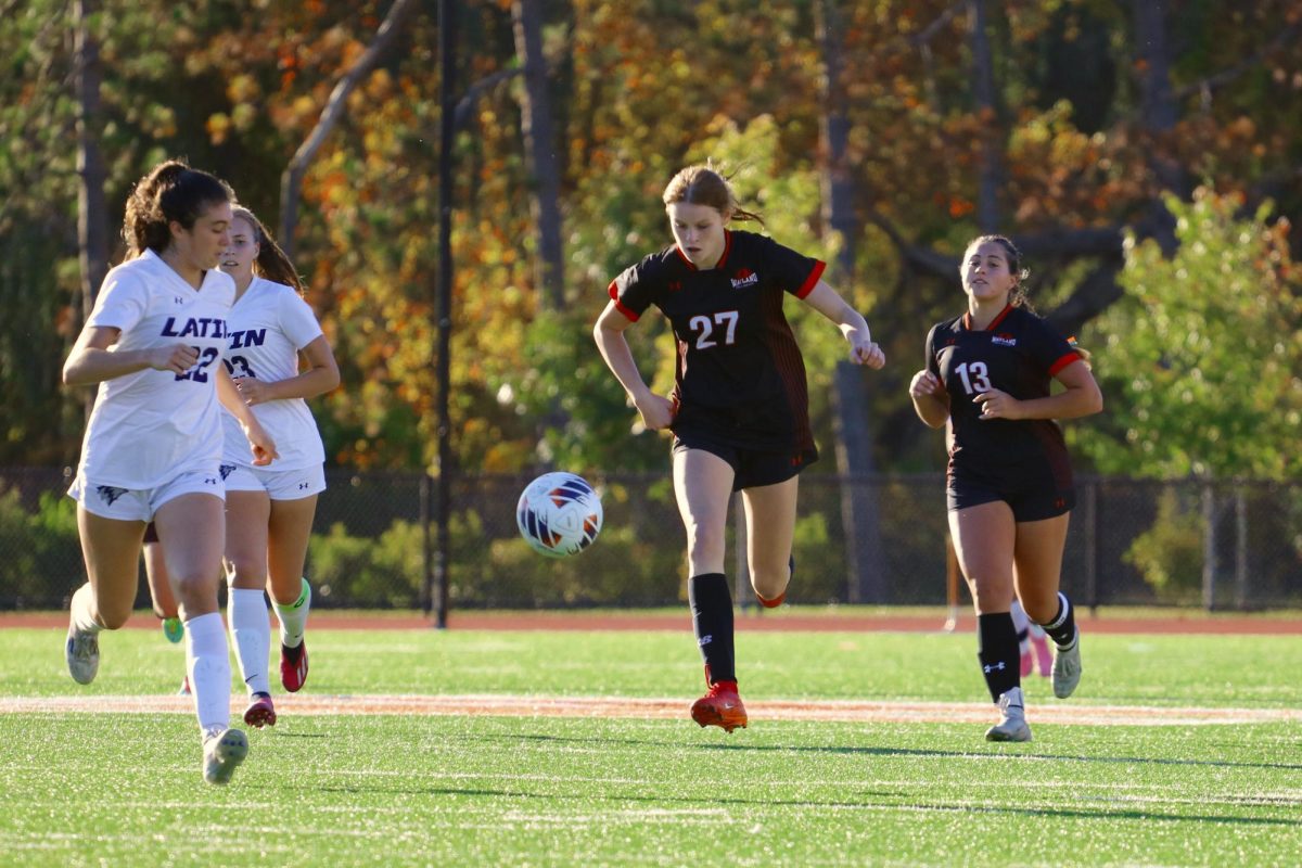 Sophomore Sazie Wrentmore receives the ball in the air before settling it.