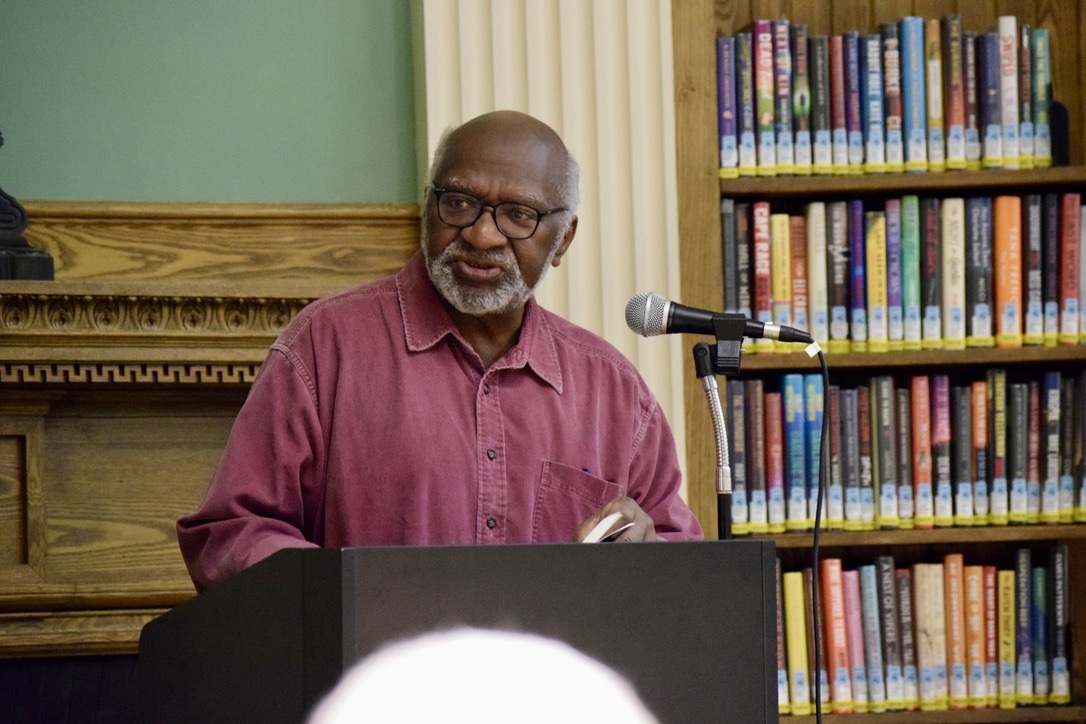 While poet, book writer and musician Charles Coe reads a poem, he briefly looks up from his book to survey the crowd. Join Co-Multimedia Editor Sofia Ciciarelli as she covers the impact of Coe's poetry, the significance of Arts Wayland for the community and the response of the residents of Wayland after hearing Coe's poetry.