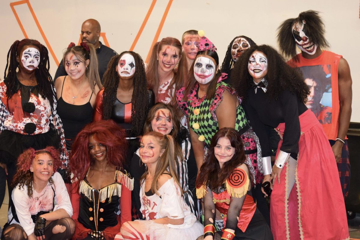 After exiting the haunted house the volunteers who are the "scarers" all gather to take a picture. "Keep coming to the Connect Program haunted houses, through the years, and support Connect," senior Nelahn Bonds said.