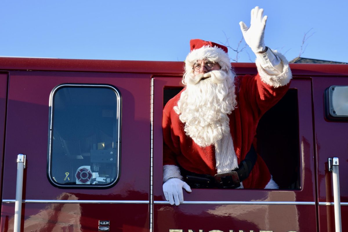 As it reaches three o'clock, Santa is escorted by some police and fireman. Each year, the Wayland Fire Department stops by several neighborhoods in Wayland and gives the opportunity for kids to tell Santa their Christmas wish.