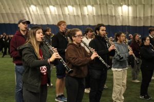 WHS alum Thomas Creavin practices the clarinet alongside his bandmates the Monday before Macy's annual Thanksgiving Day Parade. Creavin is part of the University of Massachusetts Amherst Marching Band.