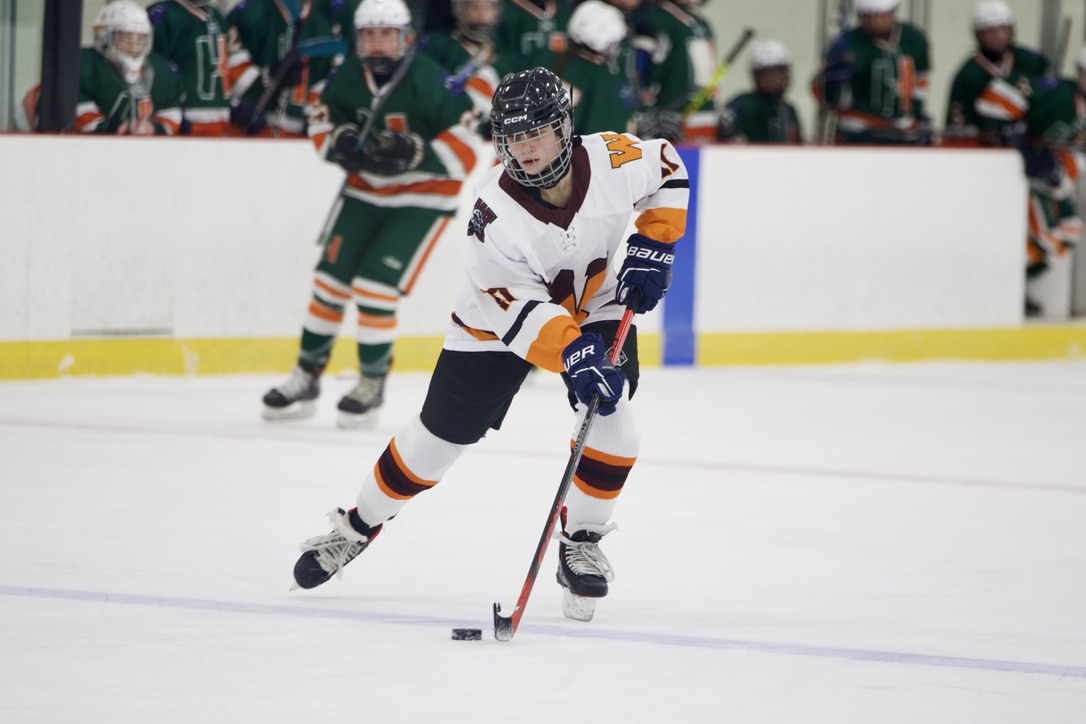 Skating towards the Hopkinton net, sophomore Lexi Roman cuts to the outside area of the ice to take advantage of a mistimed Hopkinton line change.