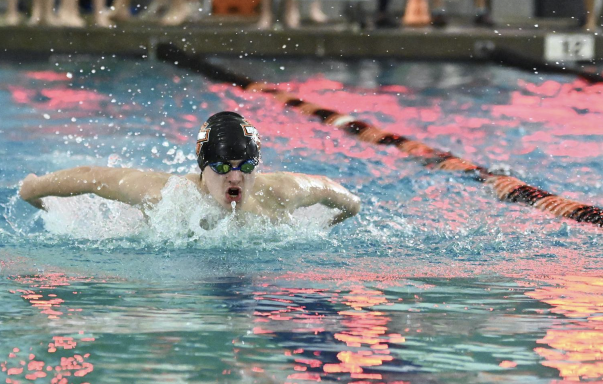 Senior Brady Foley comes up for air as he swims his way through his race.