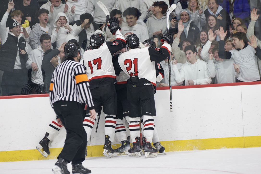 After the Raider's first goal of the game, scored by senior captain Luke Galizio, the players pile onto the glass by the student section to celebrate, igniting the crowd into a roar. "The atmosphere was incredible, having two towns that both come to support us is amazing," Galizio said. "When [the crowd] started chanting 'Raider nation' it made [the game] feel like it wasn't just one team against another, we had a whole building of fans supporting us."